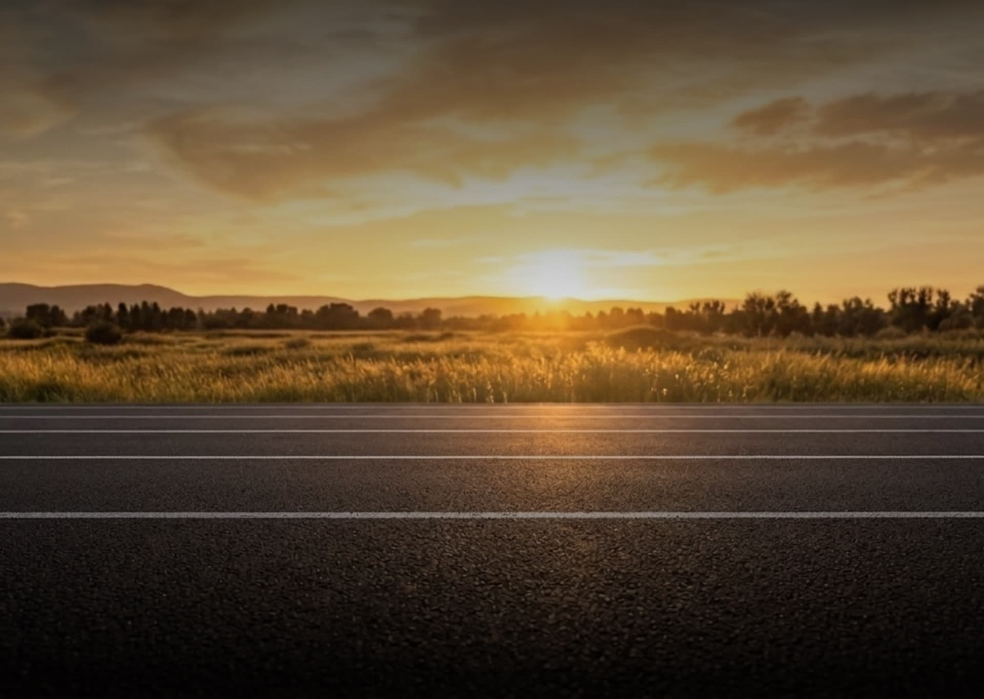 Runners on an open road at sunrise
